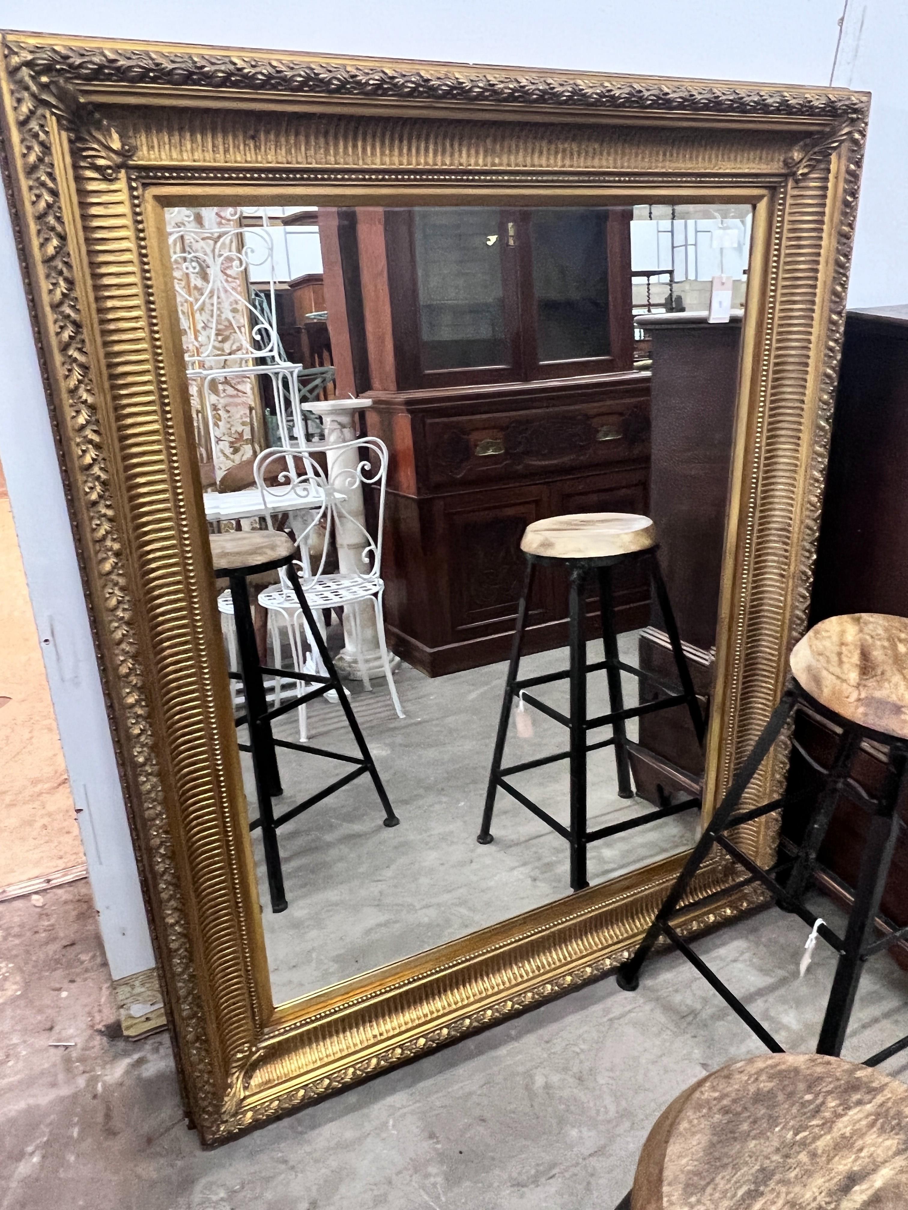 A large Victorian style rectangular gilt wall mirror, width 123cm, height 154cm